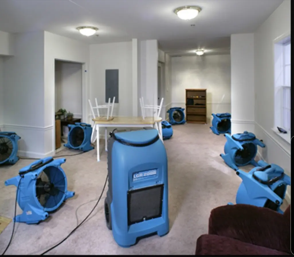 Air movers and dehumidifier setup for Water Damage Restoration in Holbrook